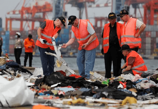 Investigators examining wreckage from a Boeing 737 MAX crash.